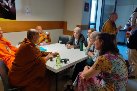 Buddhist Monks and Musilm Woman