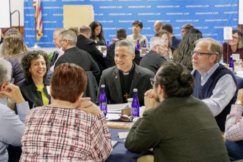 Group of people talking on a round table