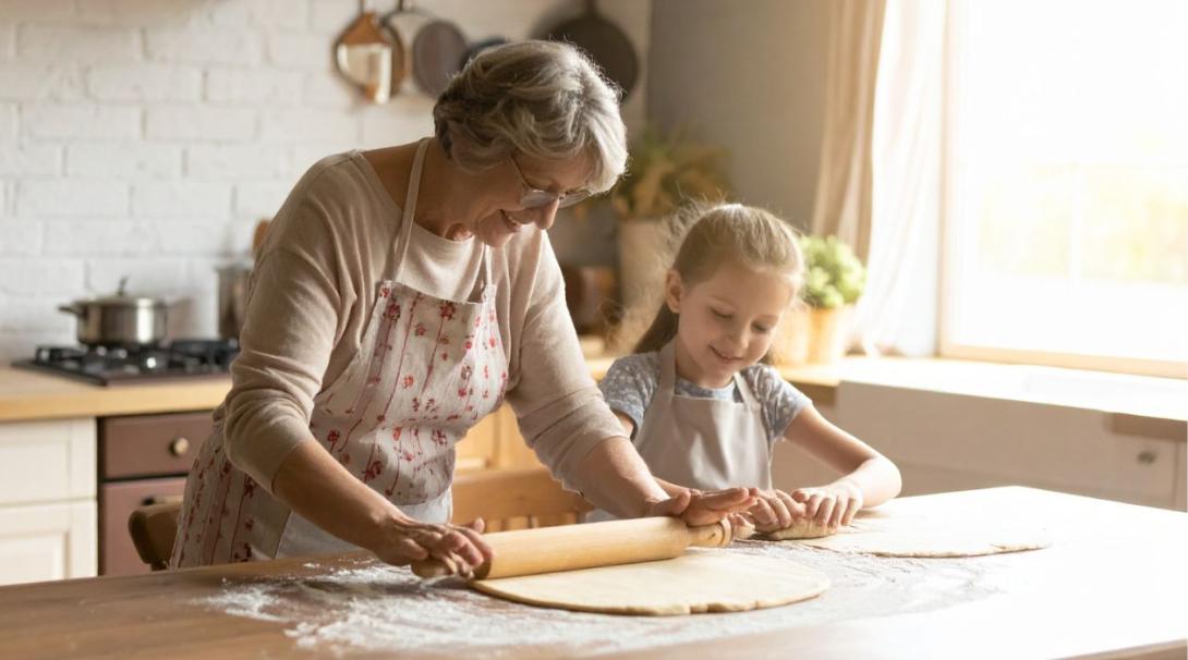 Warm, inviting kitchen scene with an elderly grandmother and her granddaughter baking 