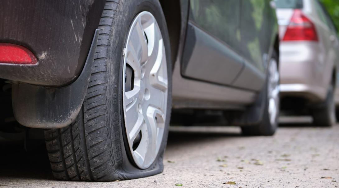 Flat Tire on the side of the curb