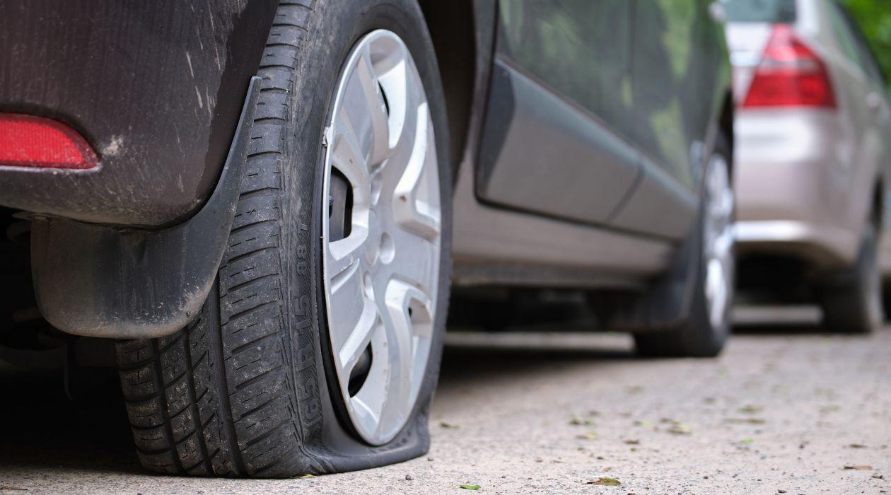 Flat Tire on the side of the curb