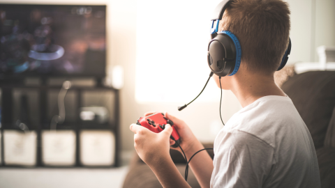 young person playing videogame