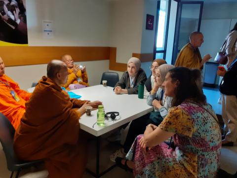 Buddhist Monks and Musilm Woman